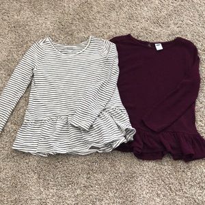 Two long sleeve ruffle bottom accent shirts